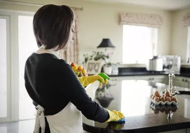 Woman cleaning the work surface