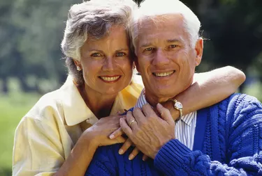 Smiling couple posing outdoors