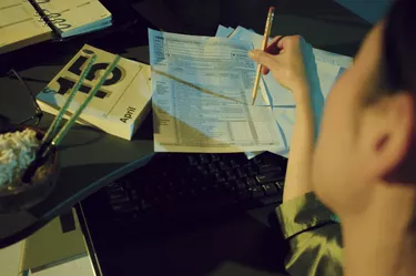 Woman completing tax form