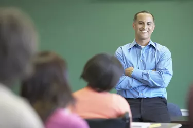 Male lecturer standing in front of a classroom