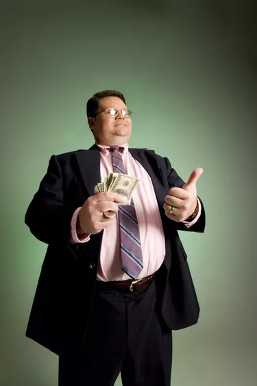 Businessman with handful of money