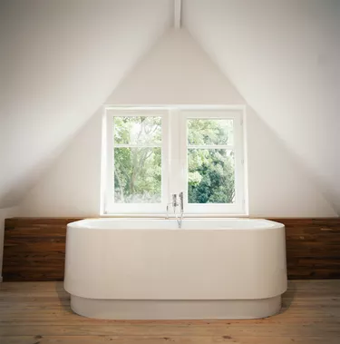 Bathtub by window