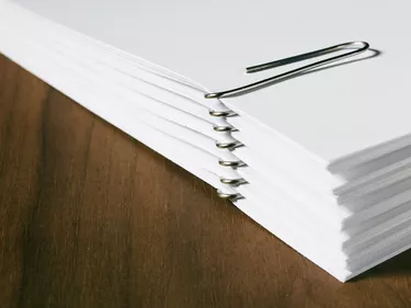 Stack of white papers with paper clips