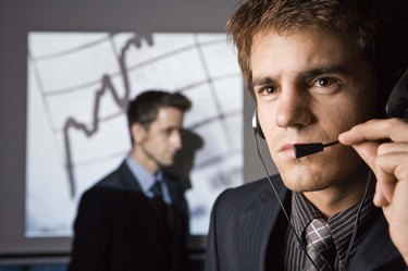 Stock market businessmen with headset