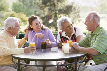 Friends Enjoying  Beverage By A Golf Course