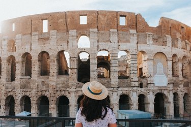 Young woman looking at the Colosseum