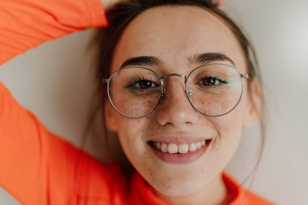 Portrait of a smiling freckled woman