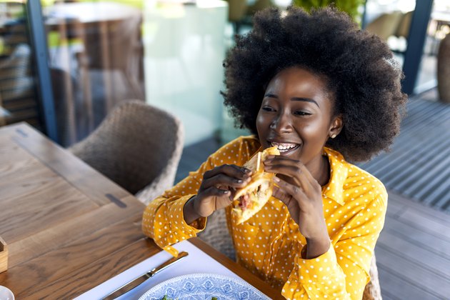 Happy young woman taking break