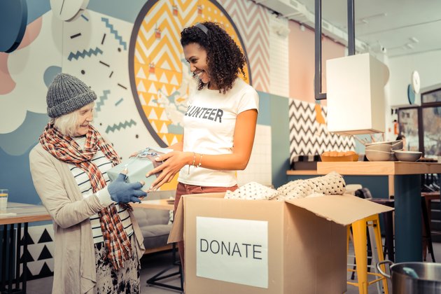 Positive afro American woman giving a nice gift