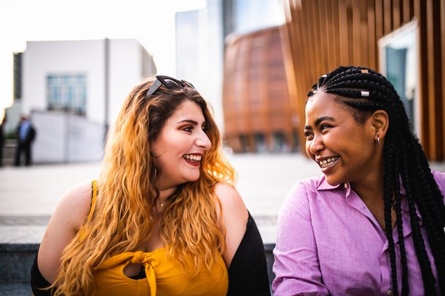 Two beautiful friends laughing