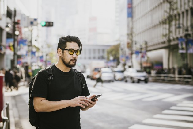 Asian Man waiting for his Driver