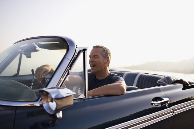 Man driving convertible