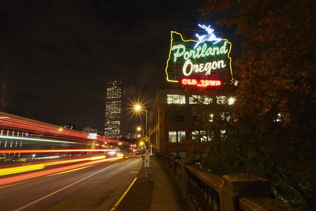 Highway and neon sign at night, Portland, Oregon, USA