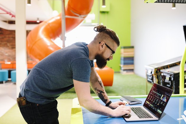 Computer programmer working in creative office