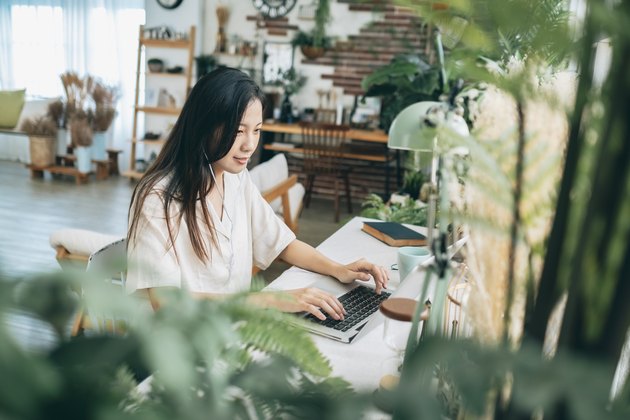 asian woman working at home