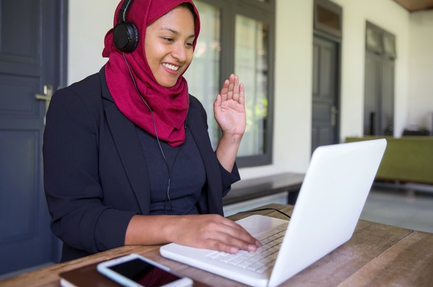 Malaysian business woman doing video conference during home quarantine Covid 19