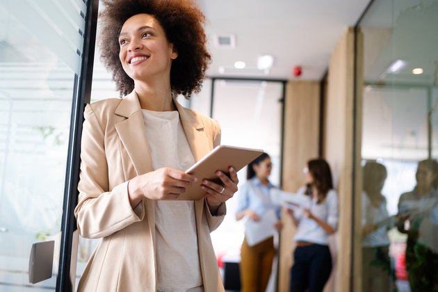 Young african american woman working with tablet in office