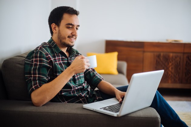 Young man working in his home office