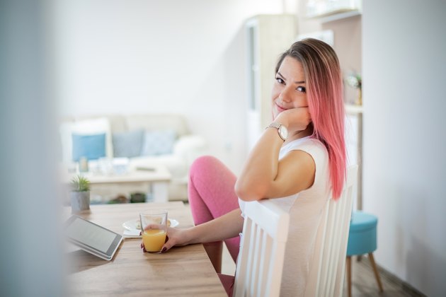Woman having breakfast in pajamas
