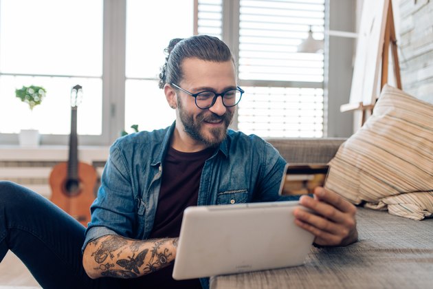 Portrait of a young man spending money online