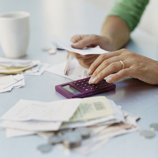 Woman Using a Calculator