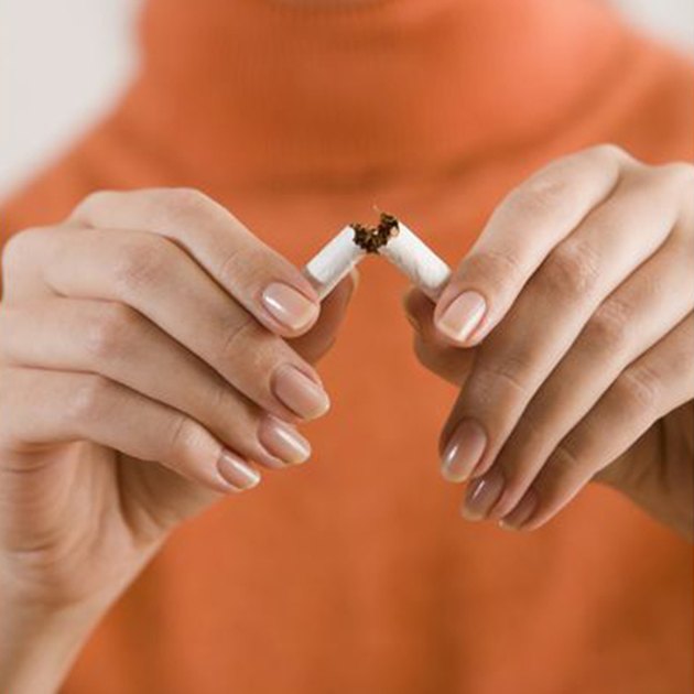 Woman breaking cigarette