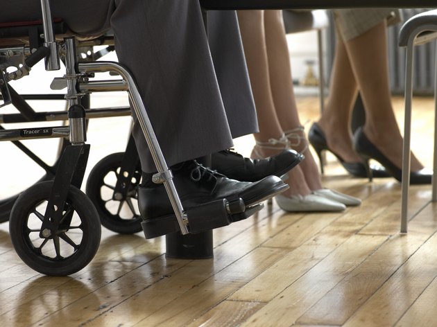 Low Section of Business Men and Women, Man Sitting in a Wheelchair
