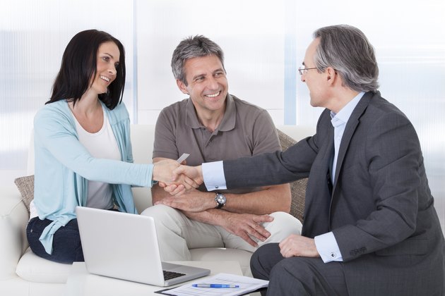 Consultant Shaking Hand With Woman