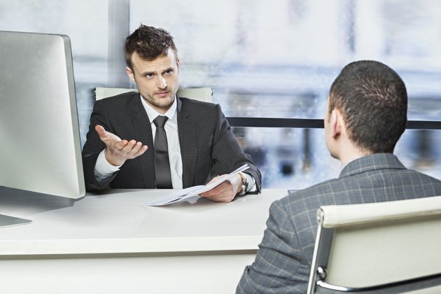 Manager discussing a problem with employee