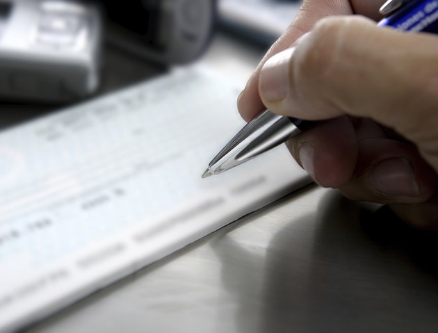 "Signing a bank check, business metaphor"