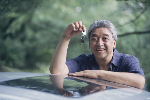 Man standing by car