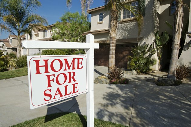 Home For Sale Sign & New House