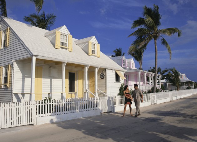 Couple walking by house