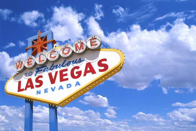 The ?Welcome to Fabulous Las Vegas Nevada' sign against a blue sky with fluffy white clouds