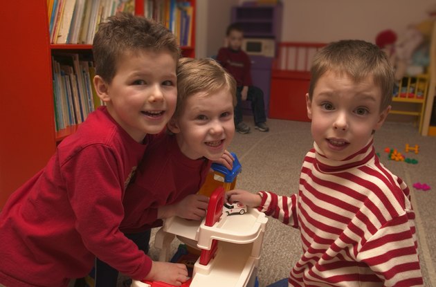 Three boys playing together at preschool