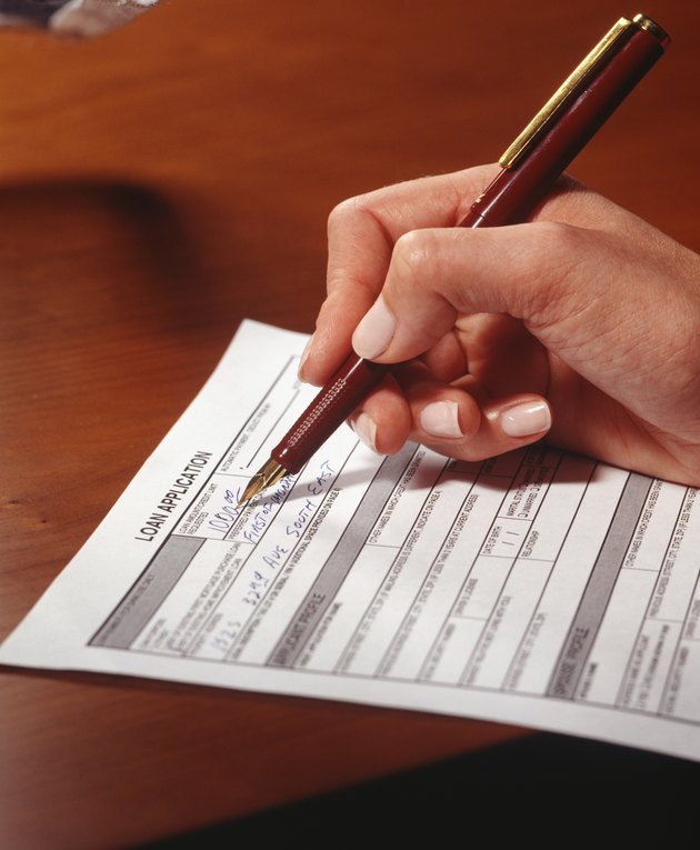 Woman filling in application form, Close-up of hand