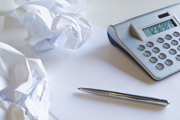 Crumpled paper and calculator