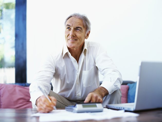 mature man using a calculator