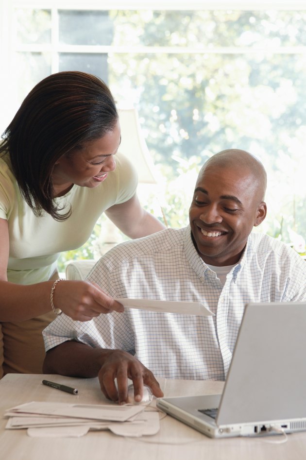 Couple paying bills online