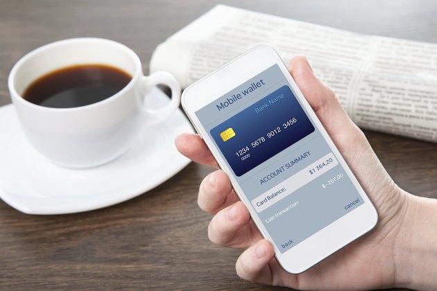 businesswoman hand holding a phone with mobile wallet online shopping