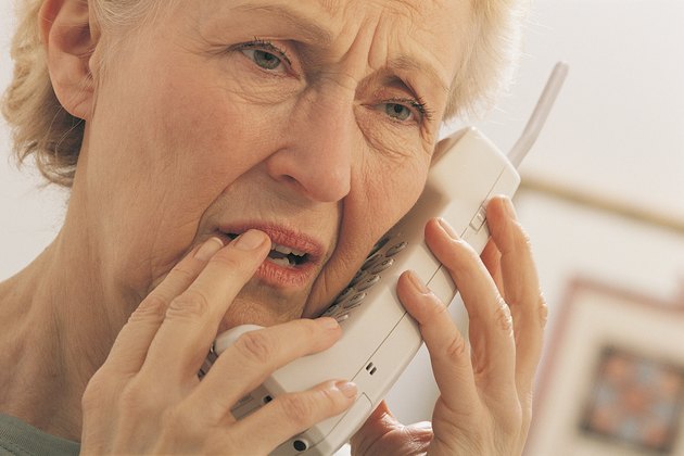 Worried woman on telephone