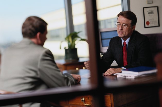 Businessmen Talking in an Office