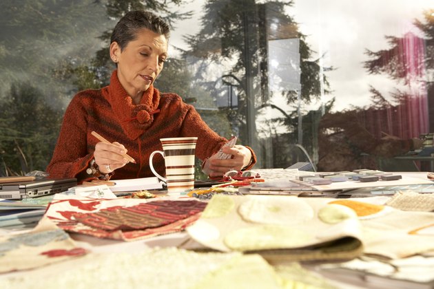 Mature woman working at desk at home