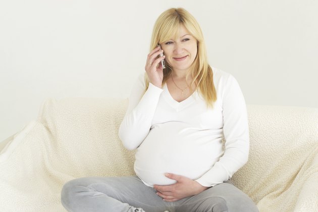 Pregnant woman relaxing on the sofa