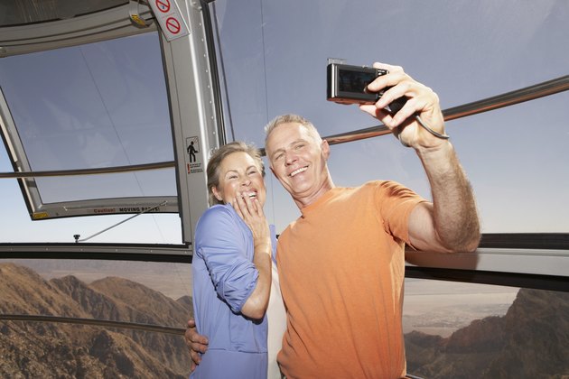 Mature Couple taking pictures while on tram