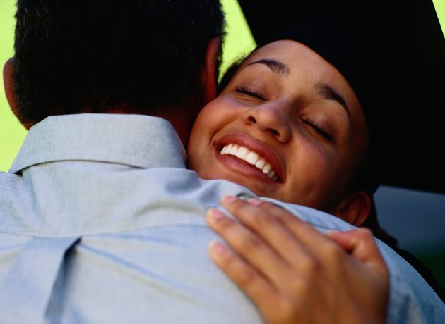 Happy Graduate Hugging her Father
