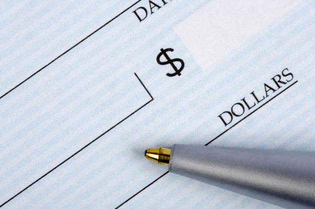 Closeup of check with pen