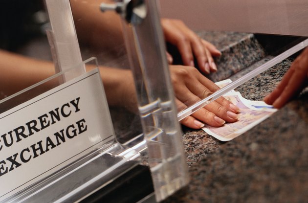 Teller Exchanging Money at a Currency Exchange