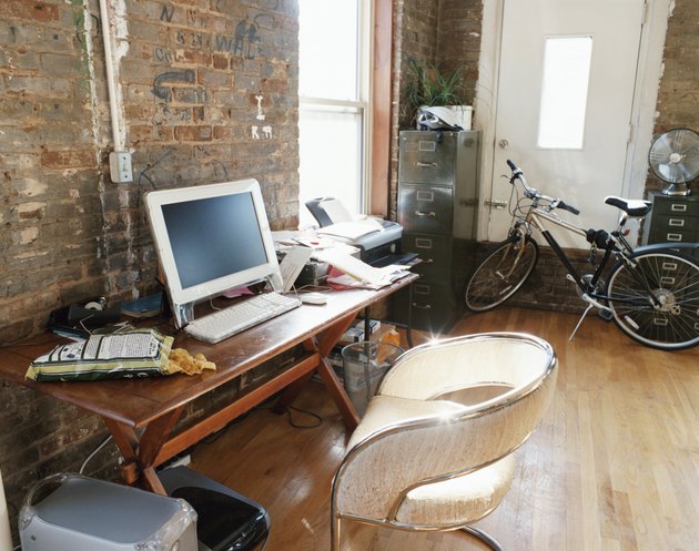 PC, Desk and Bicycle Inside an Apartment