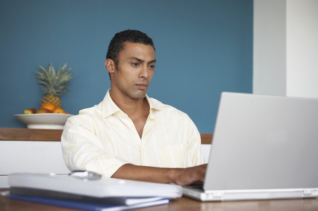 Young Man Using Laptop
